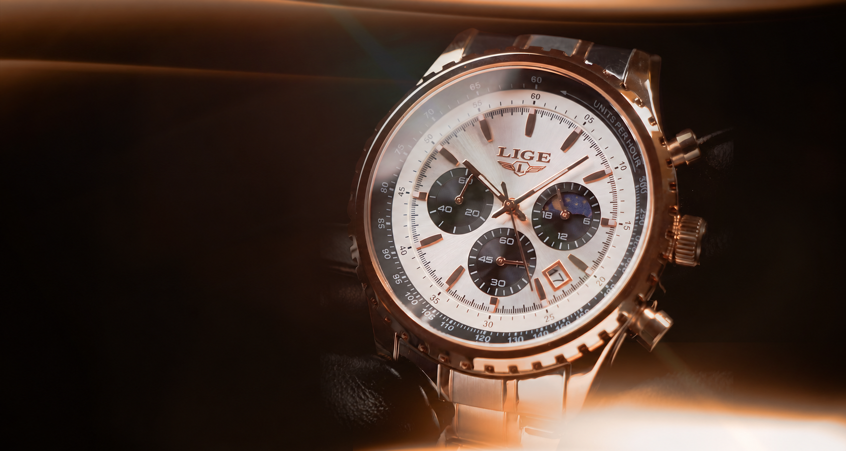 Close-up of a white-dial chronograph with a rose-gold case